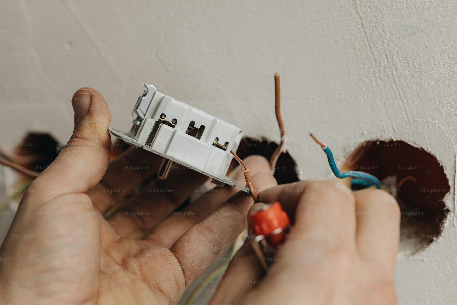 Professional electrician working in a Christchurch home